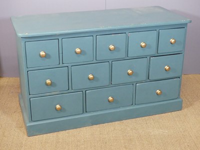 Lot 706 - A painted pine low chest fitted with 12...