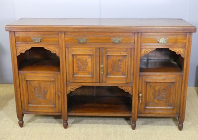 Lot 709 - An Edwardian floral line relief carved dresser...