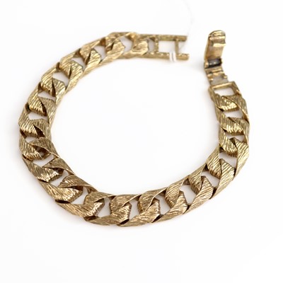 Lot 196 - A modern 9ct gold textured curb link bracelet,...