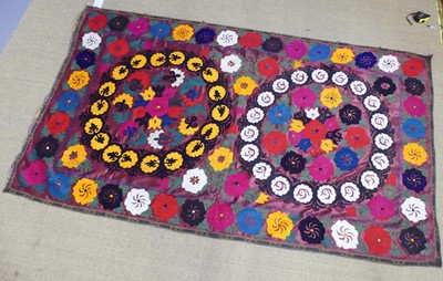 Lot 725 - An embroidered Uzbekistani Suzani wall hanging,...