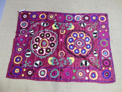 Lot 731 - An embroidered Uzbekistani Suzani wall hanging,...