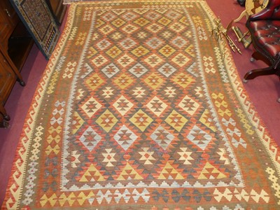 Lot 733 - An Afghan kilim woollen rug, bright colour...