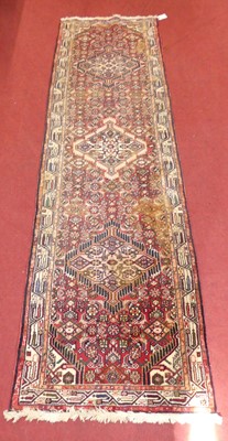Lot 738 - A Persian woollen red, blue and cream ground...