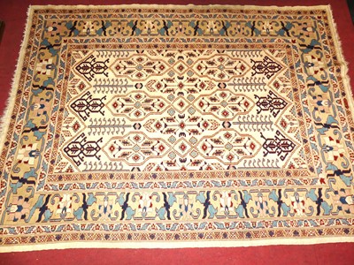 Lot 743 - An Afghan cream ground woollen Kazak rug, 188...
