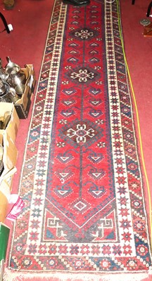 Lot 746 - A Persian woollen red, blue and cream ground...