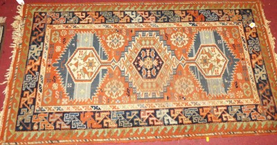 Lot 748 - A Persian woollen rust ground Heriz rug, 172 x...