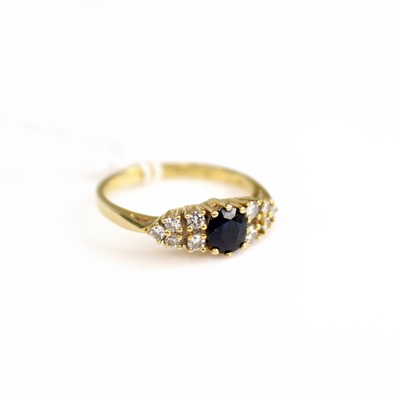 Lot 198 - A modern 18ct gold, sapphire and diamond...