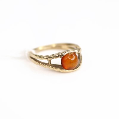 Lot 199 - A modern 9ct gold and cabochon orange amber...