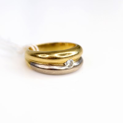 Lot 202 - An 18ct yellow and white gold band ring,...