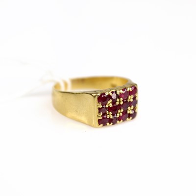 Lot 203 - A yellow metal and ruby set signet style ring,...