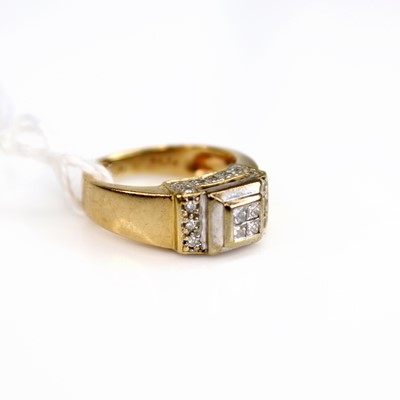 Lot 204 - A yellow metal diamond dress ring, the raised...