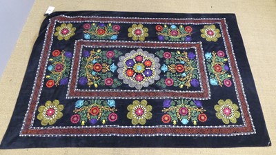Lot 730 - An embroidered Uzbekistani Suzani wall hanging,...