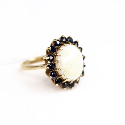 Lot 206 - A modern 9ct gold, opal and sapphire set dress...