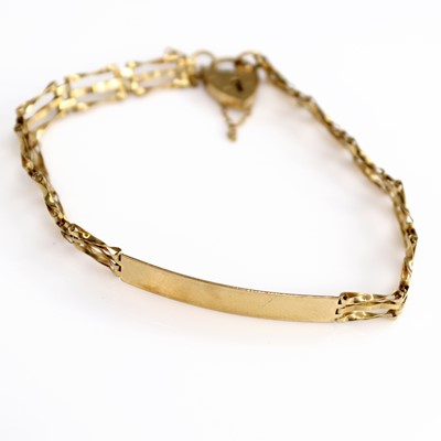 Lot 207 - A lady's 9ct gold gatelink identity bracelet,...
