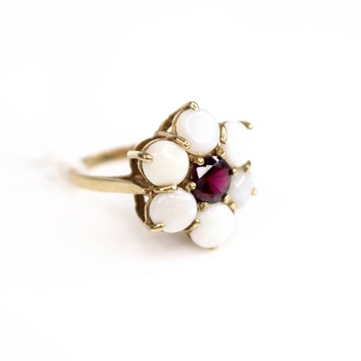 Lot 208 - A 9ct gold, garnet and opal flowerhead cluster...