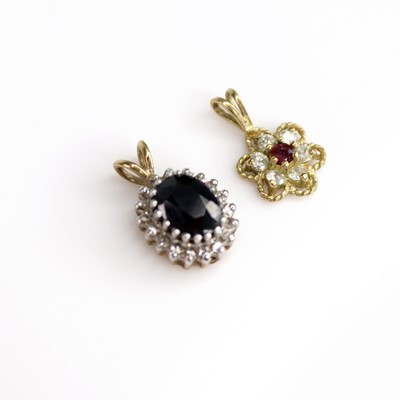 Lot 210 - A 9ct gold, blue and white sapphire set...