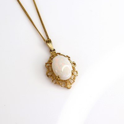 Lot 212 - A modern 9ct gold cabochon opal set pendant, h....