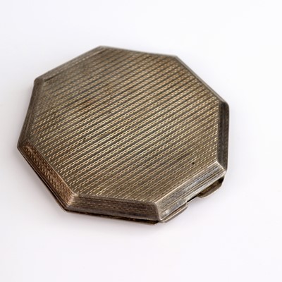 Lot 230 - An engine turned silver powder compact with...