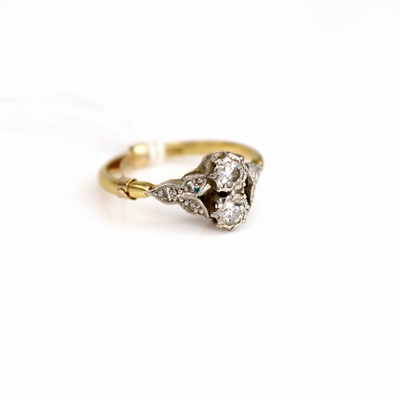 Lot 231 - An 18ct gold and platinum diamond two stone...